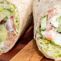 Veggie Wrap · Served with Feta cheese, avocado, and ranch dressing, cucumber, lettuce, tomato, onion.