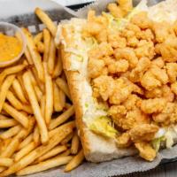 Fried Shrimp Po-Boy · It comes with lettuce, tomatoes, pickles, mayo, and served with french fries.