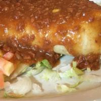Chimichanga Plate · 12-inch fried burrito filled with beef or chicken, beans, topped with chile con carne, with ...