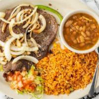 Carne Asada Plate · Two thin sirloin steak served with grilled onions and bell peppers.