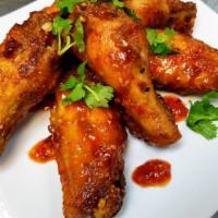 Chili-Garlic Wings (6) · Fried wings tossed in chilli-garlic sauce.