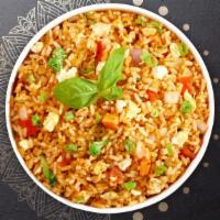 Tomi Lee Tom Yum Fried Rice · Stir fried rice with egg, mushroom, scallion and spicy tom yum paste. Spicy.
