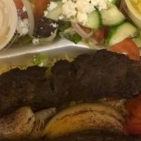 Beef Skewer Hummus Bowl · Grilled beef over hummus, diced cucumber and tomato salad, shredded lettuce and a drizzle of...