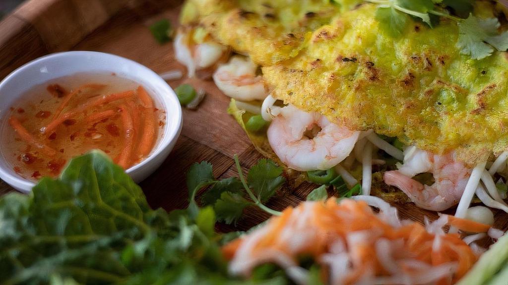 108 Vietnamese Crepe · Our version of a crispy crepe filled with pork+shrimp or tofu and bean sprouts served with lettuce, pickled veggies, and fish sauce.