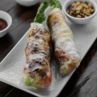 214 Grilled Shrimp Spring Rolls · Two refreshing rolls filled with vermicelli, lettuce, carrots, with grilled shrimp wrapped i...
