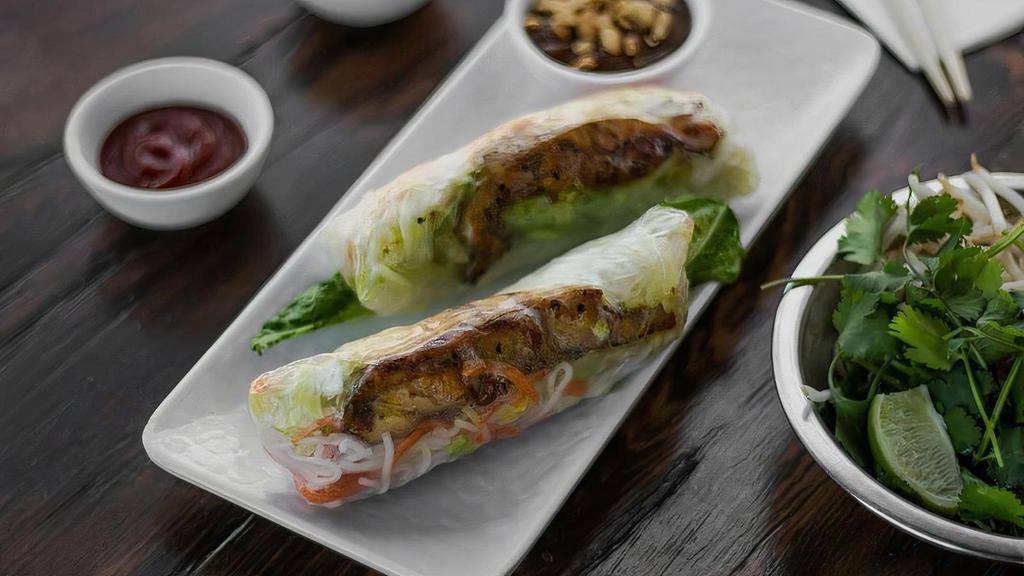 218 Chicken Spring Rolls · Two refreshing rolls filled with vermicelli, lettuce, carrots, with chicken wrapped in rice paper and served with peanut sauce.