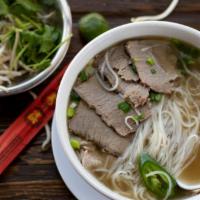 12 Brisket (Pho Chinh) · Slowly simmered Vietnamese beef broth served with rice noodles, with brisket and garnish.