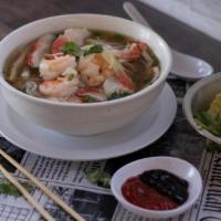 19 Shrimp Or Seafood · Slowly simmered Vietnamese beef broth served with rice noodles, with shrimp or seafood (shri...