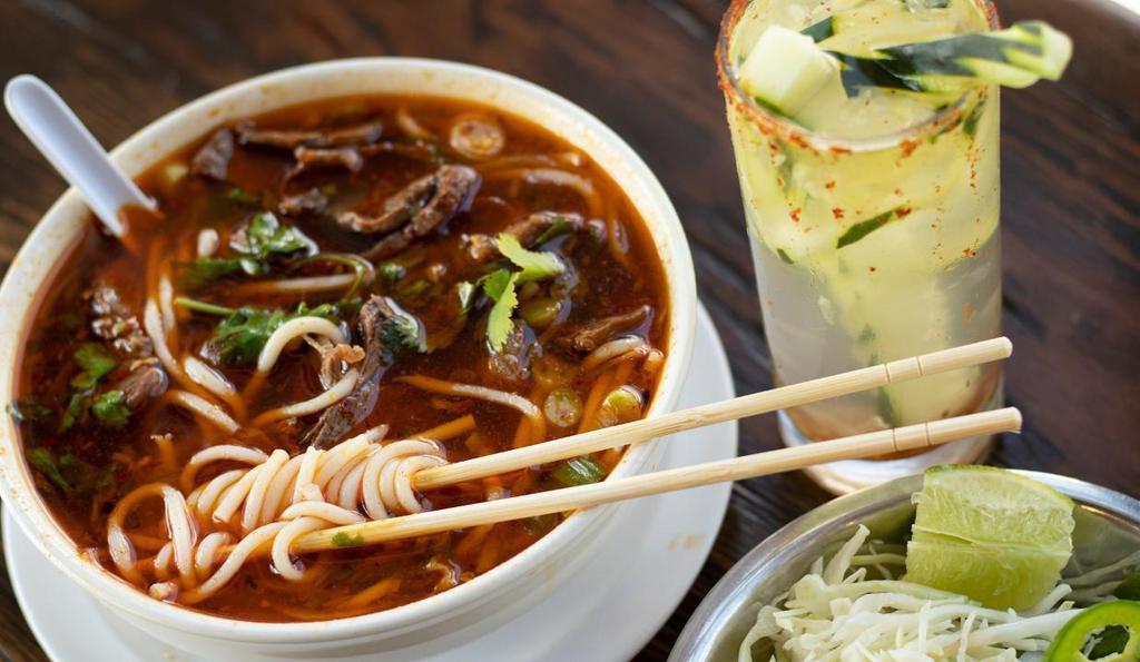 209 Spicy Beef Soup · Spicy soup and thick rice noodles topped with tender beef shank