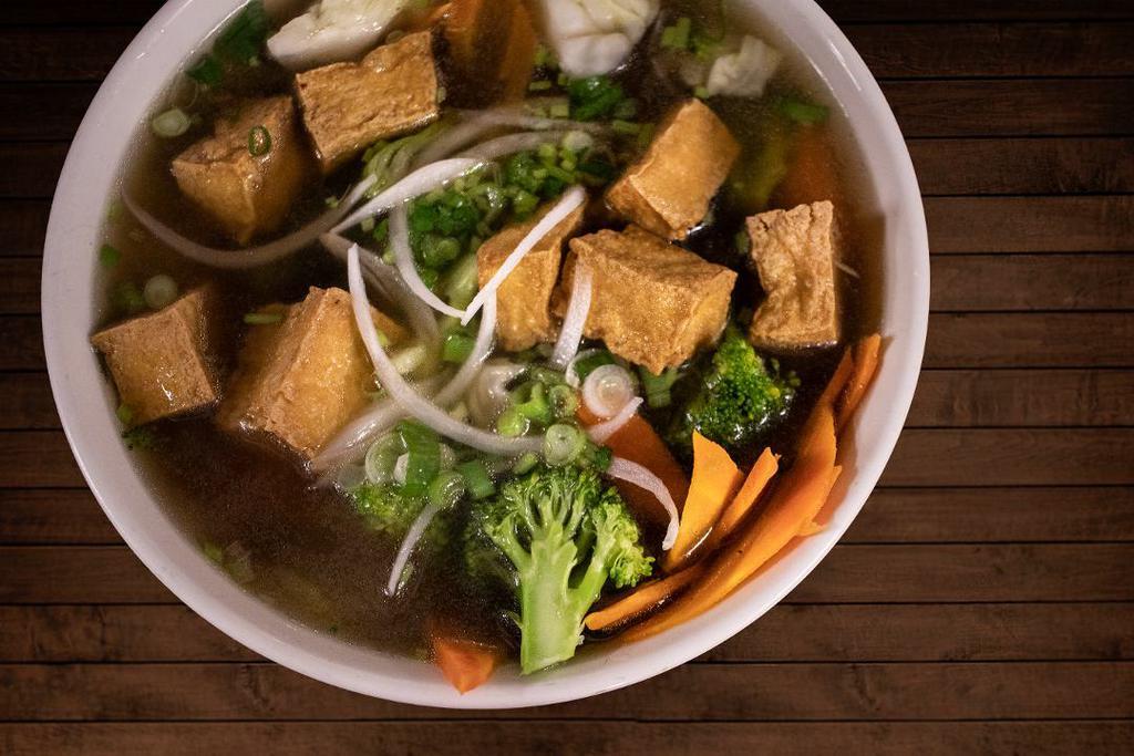 202 Veggie Tofu Rice Noodle Soup · Slowly simmered beef broth served with rice noodles,  with veggies and tofu, and garnish.