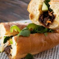 Banh Mi Sandwich · Vietnamese- style baguette sandwich stuffed with your choice of protein, cucumbers pickled v...