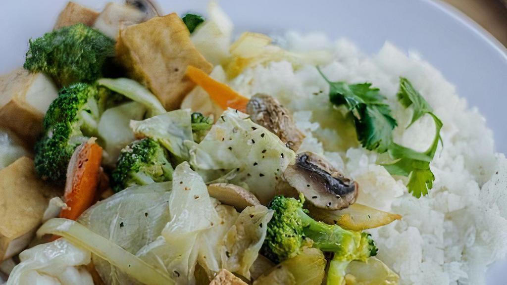 200 Vegetarian Pan Fried Tofu Mix · Fried tofu cubes with cabbage, carrots, and broccoli served with jasmine rice.