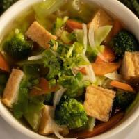 281 Veggie Rice Noodle Soup · Rice noodles with veggies and tofu in a slow simmered vegetable stock topped with onions and...