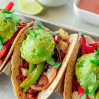 Chipotle & Chorizo (Vegan) · Non-GMO hybrid tortilla, Vegan Chipotle Chorizo, homemade refried beans, grilled peppers and...