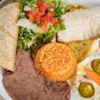 Americano Dinner · Cream chicken enchilada, brisket taco chicken tamale with spicy queso, served with Mexican r...