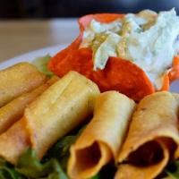 Flautitas · Six tightly rolled flautas filled with shredded chicken and fried to a satisfying crunch. Se...