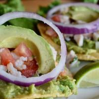Ceviche Tostadas · (Includes two) corn tostadas topped with house-made guacamole and our fresh ceviche.