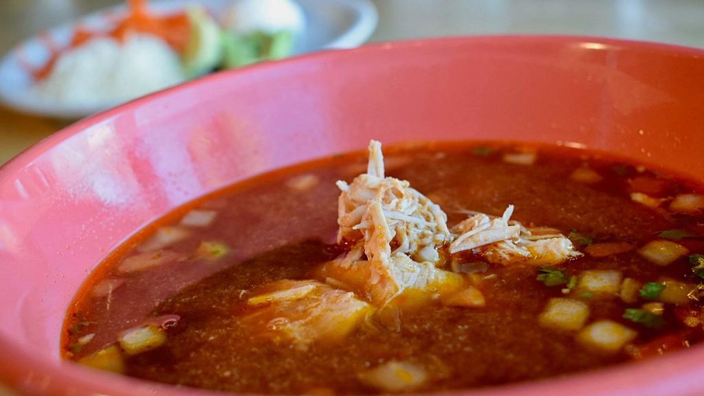 Chicken Tortilla Soup · Our large bowl of chicken tortilla soup is loaded with shredded chicken, onions, tomatoes, and jalapeños. Served with fried crispy tortilla strips, cheese, sour cream and avocado slices.