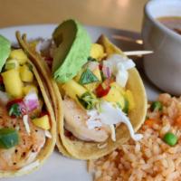 Shrimp Tacos · Two marinated grilled and seasoned or breaded coconut shrimp tacos topped with crunchy cabba...