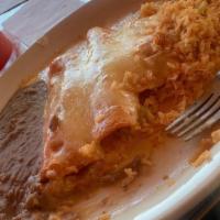Shrimp Enchiladas · Chef selection. Spicy shrimp filling topped with chihuahua cheese sauce. Served with rice, b...