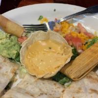 Quesadillas · Our freshly made jumbo flour tortilla filled with chihuahua cheese and any two items of your...