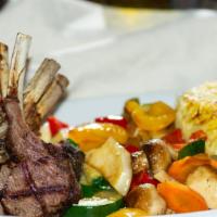 Lamb Chops · Saffron rice and vegetables.  Pita bread is included.