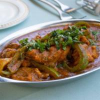 #251 Karahi Chicken · Tender cubes of chicken stir fried with bell peppers, onions, tomatoes and spices.