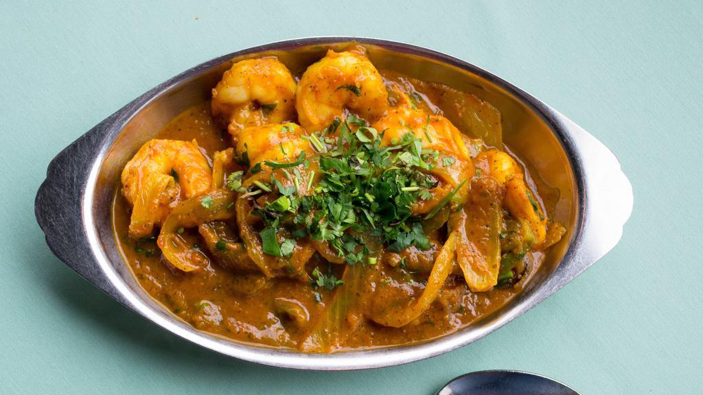 Karahai Shrimp · Fresh jumbo shrimp marinated with Indian spices. Cooked with ginger, fresh tomatoes, onions, bell pepper, tossed in Indian iron skillet.