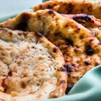 #454 Kashmiri Naan · Baked leavened bread with cashews, pistachios, raisins and cherries.
