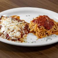 Chicken Parmigiana · Breaded chicken, homemade marinara sauce topped with mozzarella cheese, served with a side o...