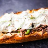 Philly Cheesesteak · Shaved steak, green peppers, onions, mushrooms, served in French bread topped with mozzarell...
