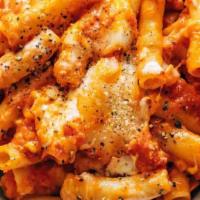 Baked Ziti · Ziti pasta smoothed in homemade marinara sauce baked with three cheeses topped with baked mo...