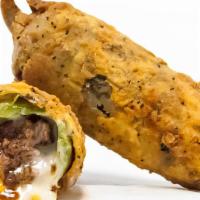The Torch · A fire roasted Jalapeno, stuffed with bacon, beef, cheddar cheese, and queso blanco then bat...