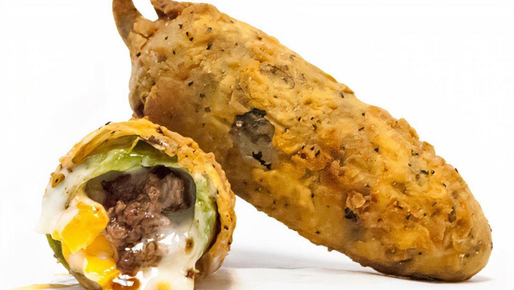 The Torch · A fire roasted Jalapeno, stuffed with bacon, beef, cheddar cheese, and queso blanco then battered and fried.