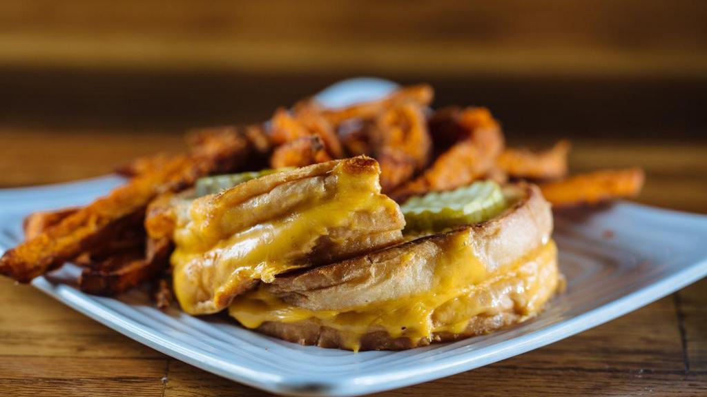 Kid Grill Cheese · American Cheese, melted between white bread, garnished with pickle slices. Served with your choice of Skinny Fries or Fruit.