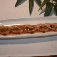 Yellowtail Heaven · Thinly Sliced Yellowtail Served with Garlic Ponzu & Chopped Jalapenos