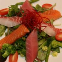 Sashimi Salad · House Salad with Marinated 6 pieces of Sashimi. Served with Ginger or Miso Dressing