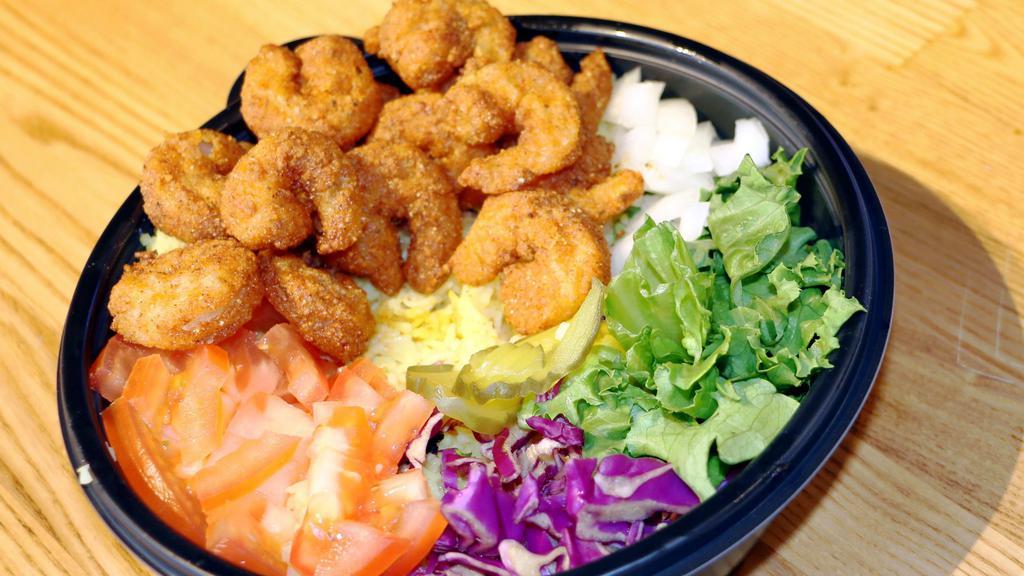 Shrimp Over Rice · Served with our Signature Exotic Basmati Rice, Lettuce, Onions, Tomatoes, Red Cabbage, and a choice of Classic, Mild, or Hot sauce