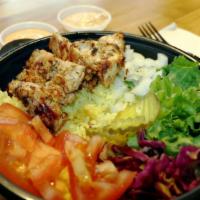 Grilled Chicken Over Rice · Served with our Signature Exotic Basmati Rice, Lettuce, Onions, Tomatoes, Red Cabbage, and a...