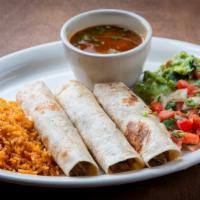 Tacos Al Carbon · Three beef or chicken fajita soft tacos. Served with rice, pico de gallo, guacamole, and cha...