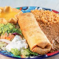 Chimichanga · One large crispy flour tortilla with Ground Beef. Served with rice, beans, guacamole, sour c...