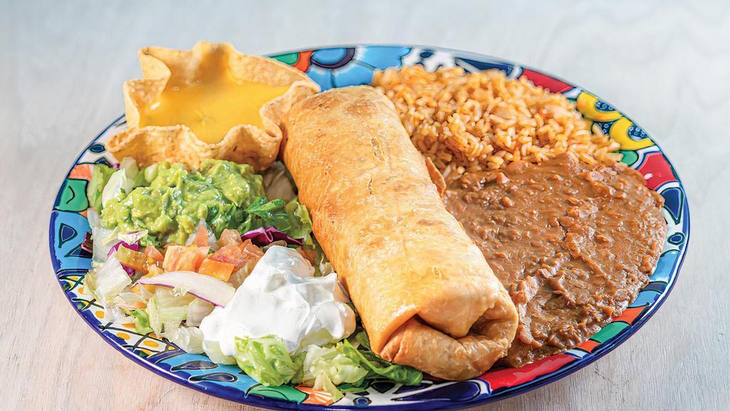 Chimichanga · One large crispy flour tortilla with Ground Beef. Served with rice, beans, guacamole, sour cream and a cheese puff. 
Add chili con queso for an additional charge.