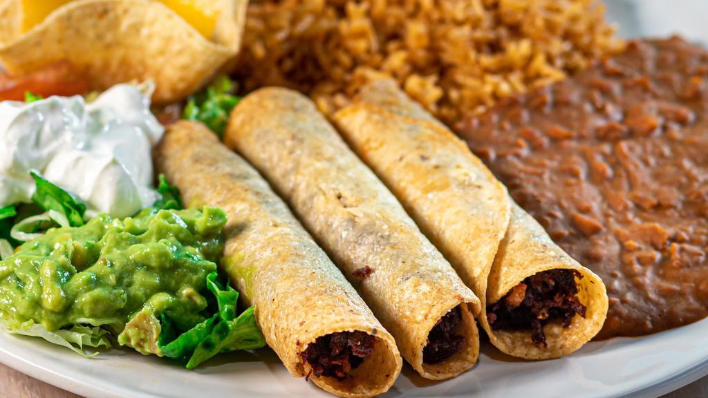 Flautas · Three beef or chicken fajita flautas. Served with rice, beans, guacamole, sour cream, and a cheese puff.