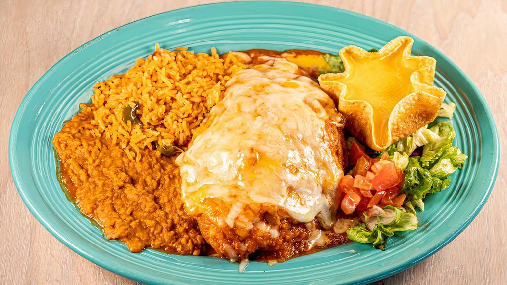 Chile Relleno · One poblano pepper stuffed with ground beef or chicken, topped with red sauce and Monterey Jack cheese. Served with rice, beans, tortillas and a cheese puff. Substitute beef fajita for an additional charge.