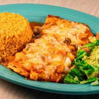 Pechuga Jalisco · Grilled chicken breast topped with red sauce and melted Monterey Jack cheese. Served with ri...