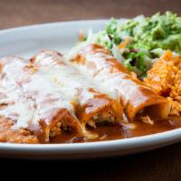 Enchiladas Al Carbon · Three fajita enchiladas covered in gravy and Monterey Jack cheese. Served with rice, beans a...