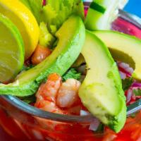 Mexican Shrimp Cocktail · Large. Cooked shrimp are chilled in a spicy tomato-juice cocktail with avocado, onions, toma...
