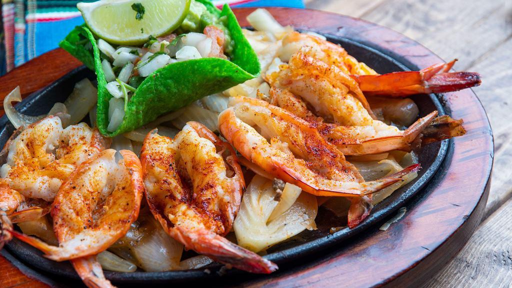 Fajita Camaron · Six grilled jumbo shrimp seasoned to perfection! Served with charro beans, rice, guacamole, tortillas, and pico de gallo.