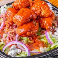 Boneless Wing Chopped Salad · Blue cheese crumbles, fresh tomato, red onion, and bacon. Choice of ranch or balsamic dressi...