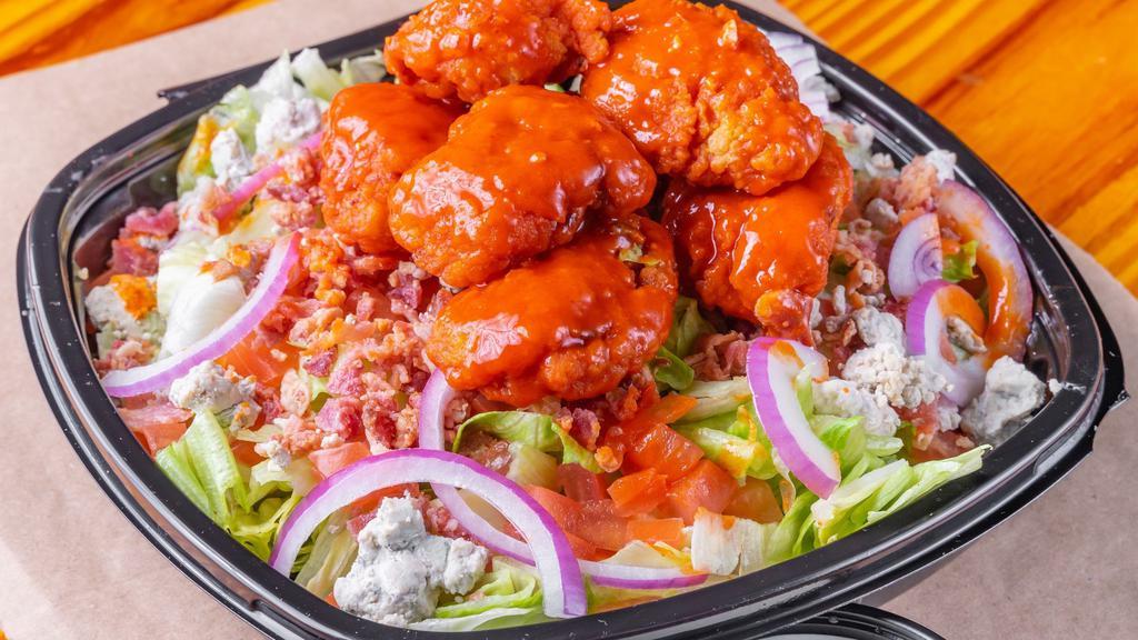 Boneless Wing Chopped Salad · Blue cheese crumbles, fresh tomato, red onion, and bacon. Choice of ranch or balsamic dressing.